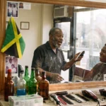 Jamaican men talking in a Bronx barbershop about the cheapest way to send money to Jamaica